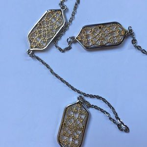 Long strand gold and silver toned necklace